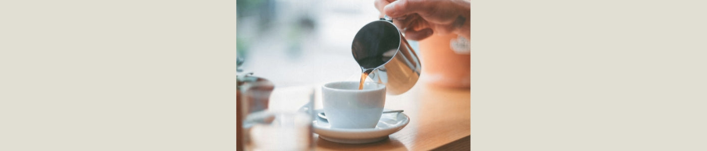 coffee pouring into mug on countertop