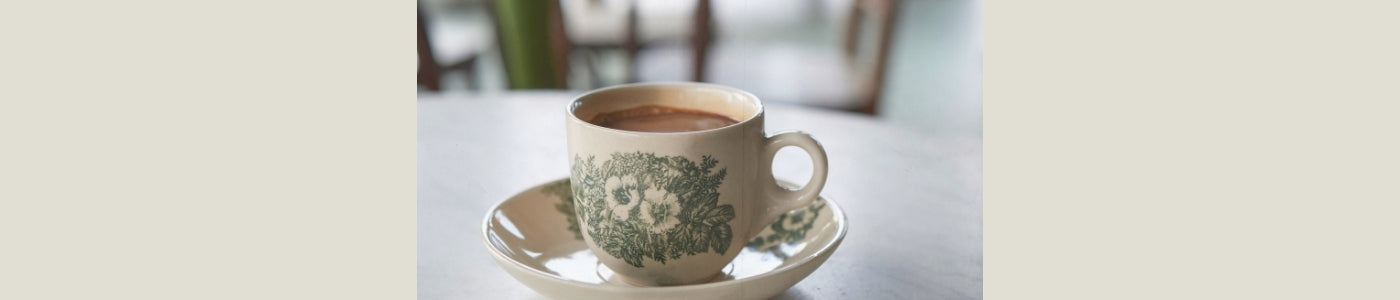 vintage green coffee mug on kitchen table